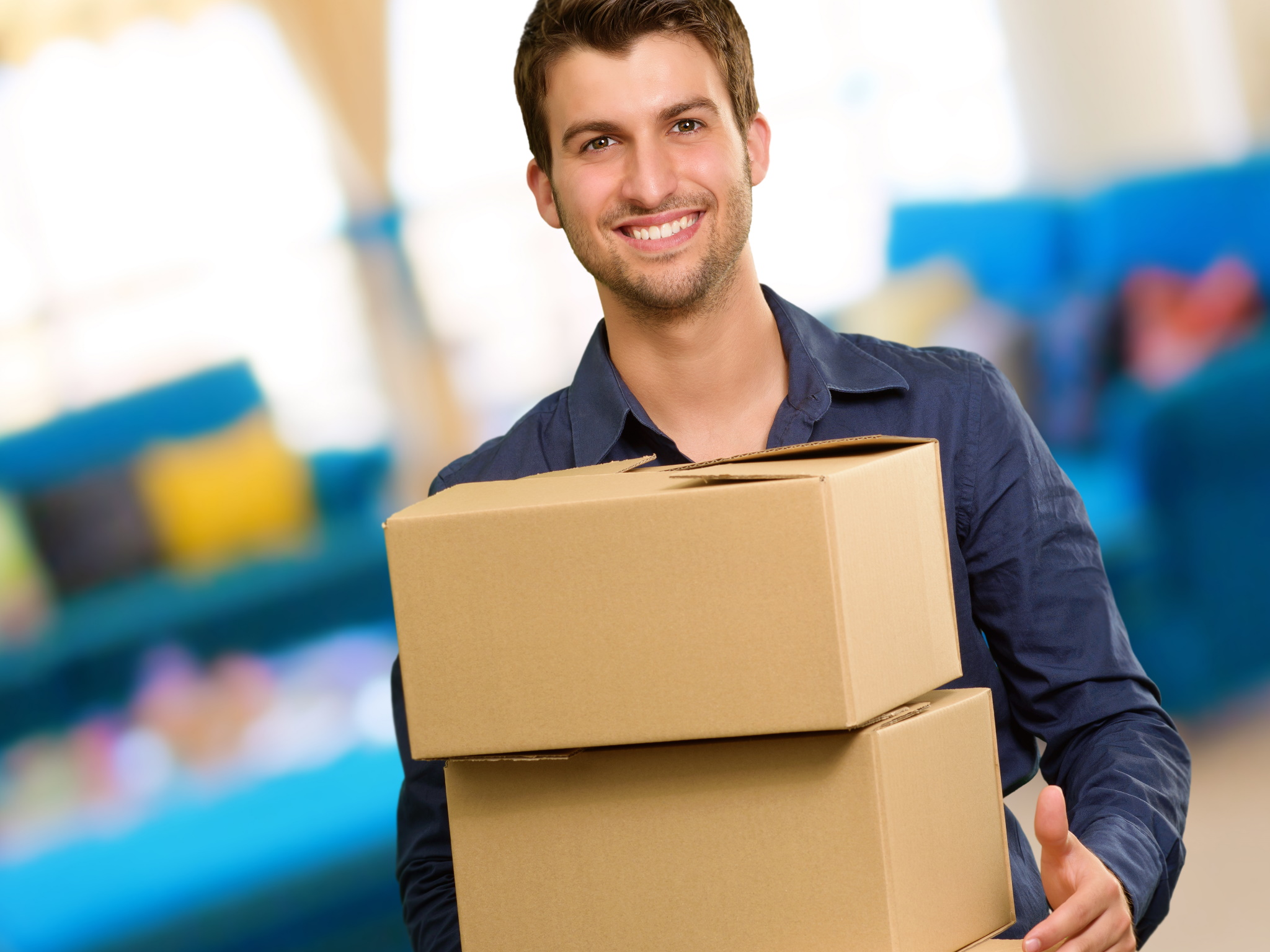 Warehouse supervisor carries packages